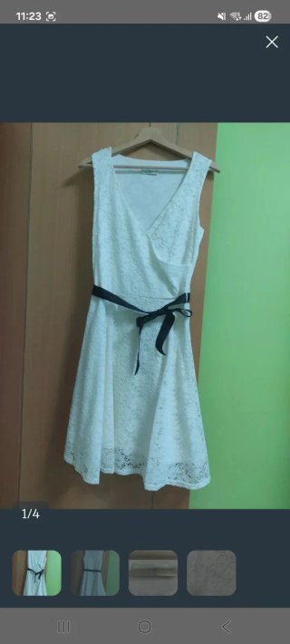 Vestido de cóctel blanco con lazo negro