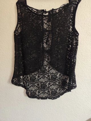 Blusa de encaje negra con lazos