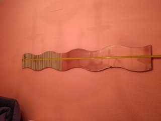Espejo de pared con diseño ondulado