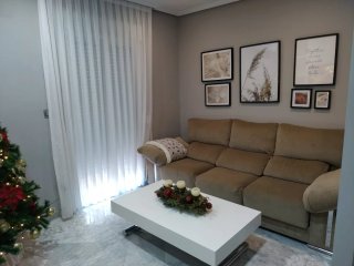 Sofá de tela beige
