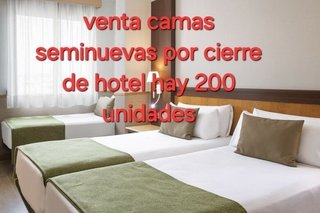 Camas seminuevas de hotel