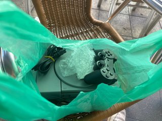 Consola PlayStation 1 (PS1) con accesorio y juegos