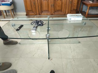Mesa de centro de cristal y acero