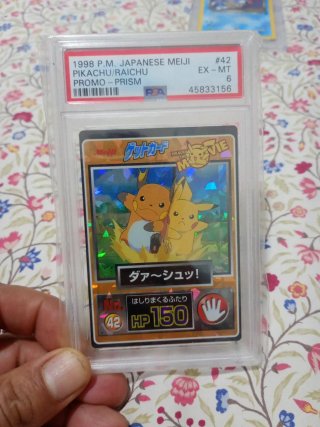 Carta Pokémon Pikachu/Raichu Meiji PSA 6