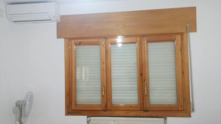 Ventanas de madera con persiana