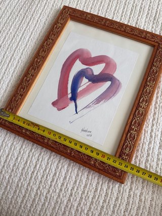 Marco de madera con lámina de corazones