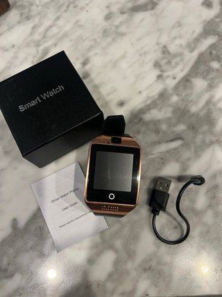Smartwatch con caja y accesorios
