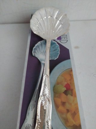 Cucchiaio grande a forma di conchiglia