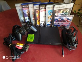 Consola PlayStation 2 con juegos y accesorios