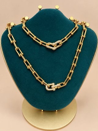 Set di Collane e Bracciale a Maglie Dorate