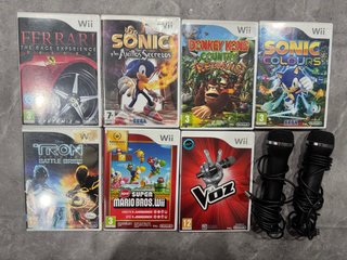 Pacchetto 7 giochi Nintendo Wii e 2 microfoni